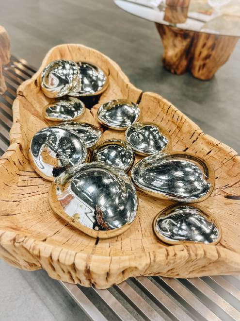 Mercury blown glass stones grouped in a cactus wood bowl
