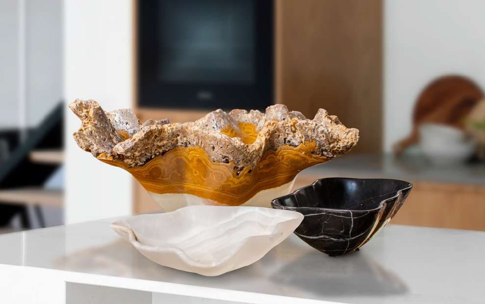 Honey, white, and black onyx bowls on view at El Dorado Gallery