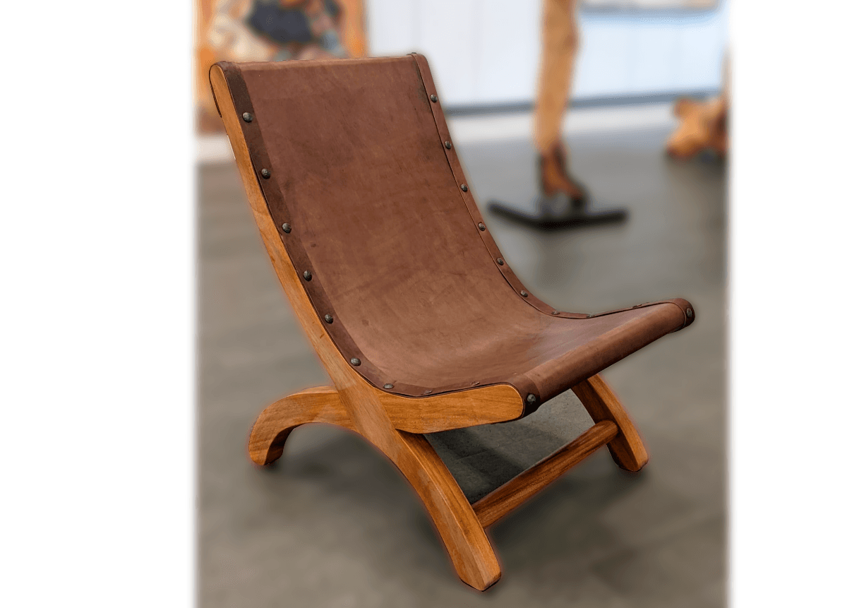 Handcrafted leather butaque chair on the gallery floor at El Dorado Gallery